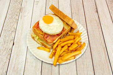 full sandwich with egg and chips
