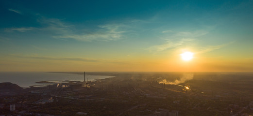 Industrial city in summer. On the horizon, a metallurgical plant near the sea. Aerial view. Mariupol, Ukraine - Drone Hyperlapse