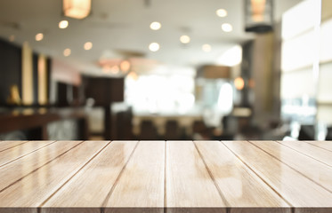 Empty wooden table top with lights bokeh on blur restaurant background, 3D Rendering