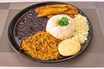 Venezuelan pabellon dish with rice, shredded meat and beans