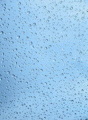 Autumn rain on the car glass