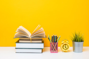 School equipment on yellow background, Education background concept.