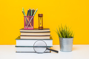 School equipment on yellow background, Education background concept.