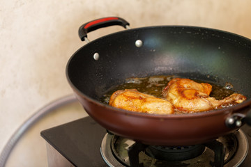 Fry the chicken in a pan with boiling oil.
