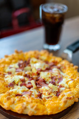 Seafood Italian Pizza slice on wood dish