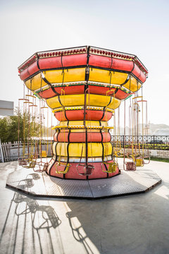 Oman, Muscat, Empty chain swing ride in Riyam Park