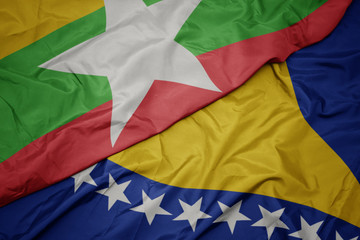 waving colorful flag of bosnia and herzegovina and national flag of myanmar.
