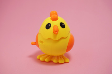 Yellow Toy chick on pink background