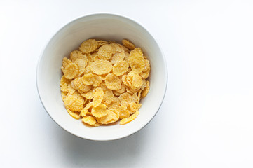 corn flakes on a white background, healthy and healthy Breakfast