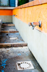 Taps at the laundry station of a French camp site.