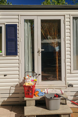 Cleaning equipment on the step of a static caravan