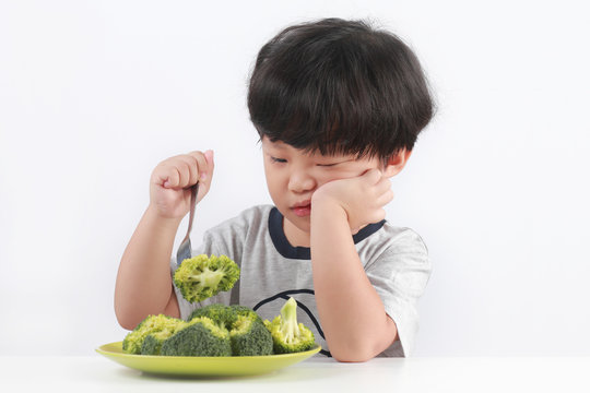 Little Asian Boy Refuses To Eat Healthy Vegetables.