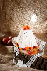 Panettone. Traditional Italian Christmas cake with orange, candied fruit, raisins and cinnamon on a...