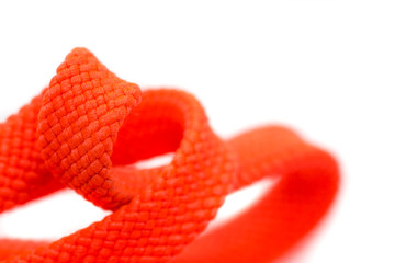 Orange shoelaces, close up, isolated on a white background