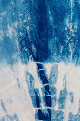 The fabric indigo tie dye as a background and texture.