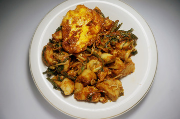 Gado Gado consists of vegetables boiled and mixed together, with mashed bean spices. gado-gado. traditional indonesian food. rice cake, egg and vegetable with peanut sauce   