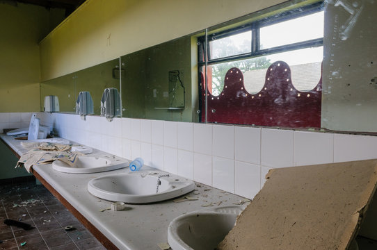 Sinks in the bathroom of an abandoned hotel
