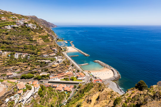 Portugal, Madeira, Calheta, High angle view of coastal town and artificial bay in summer