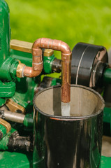 Stationary engine pumping water