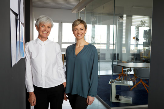 Portrait of two confident businesswomen in office