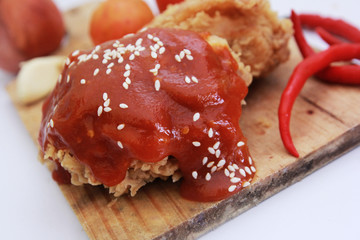 Sweet and spicy sauce with sesame. Fried Chicken.