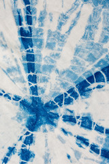 The fabric indigo tie dye as a background and texture.
