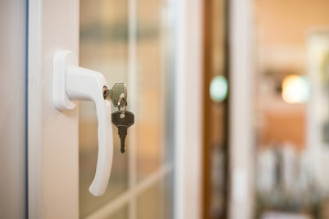 Secure window handle with key in closeup