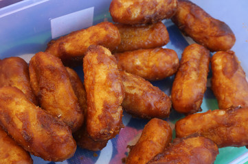 Gemblong  /gem-blong/ is a kind of traditional Indonesia. It is made from glutinous rice flour coated with palm sugar caramel.