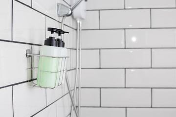 Modern hotel bathroom with Liquid soap, shampoo bottle