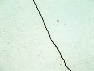 
Crack in the wall of the building. Blurred defocused background for web design.