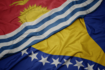 waving colorful flag of bosnia and herzegovina and national flag of Kiribati .