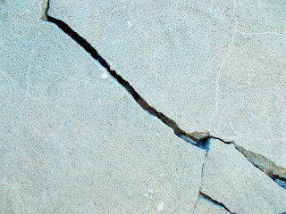 
Crack in the wall of the building. Blurred defocused background for web design.