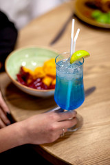 
singing colored cocktails from glass goblets