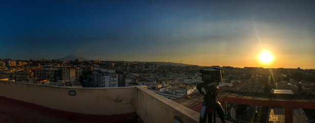 Sunrise over the city of Catania with the volcano Etna