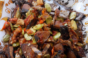 Sambal Oseng petai or pete with ikan asin (salted fish) is one of traditional food from indonesia. has a savory and spicy taste. 