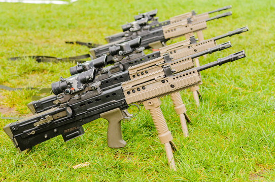 A row of British Army SA80 L85A2s sitting on grass