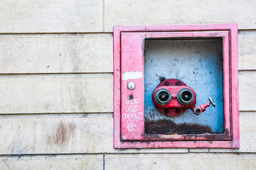 Fire hydrant on the side of a building for fire brigade service to use for fire fighting