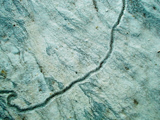 
Crack in the wall of the building. Blurred defocused background for web design.