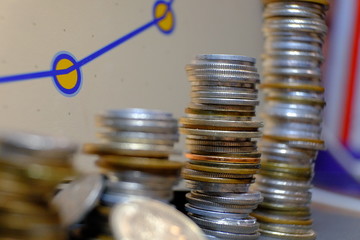 Image of coins stacked so that they gradually increase