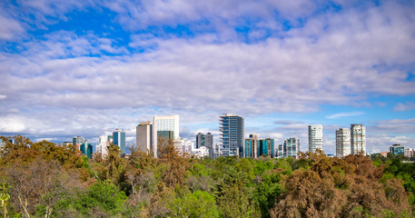 Fototapeta premium Panoramic view of Mexico city skyline on sunny day.