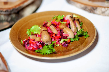 vinaigrette with pickled mushrooms in a plate on the table