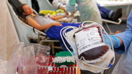 Donor donates blood in a hospital