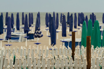 View of the umbrellas on the beach at Grado, Italy