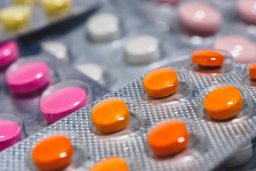 Many colorful tablets in a blister pack. The concept of the pharmaceutical industry. Pharmacy-Pharmacy.