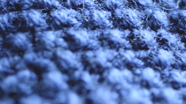 blue handknitted fabric texture closeup