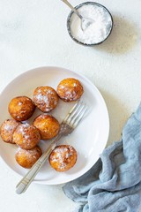 Doughnuts. Homemade cakes made from curd balls. Freshly made donuts from cottage cheese with powdered sugar. Cottage cheese donuts. Selective focus
