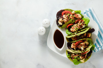 gluten-free vegan green tachos made from chickpea flour with spinach and toppings from baked...