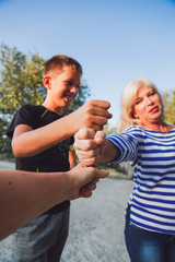 Family members holding each other with hands. Holding hands together. Togetherness concept. 