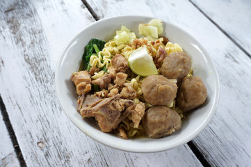 Chicken noodles soup  with meatball and vegetable.           