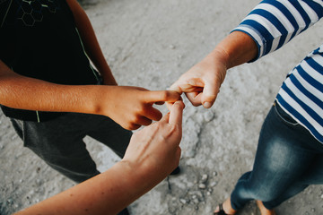 Family members holding each other with hands. Holding hands together. Togetherness concept. 